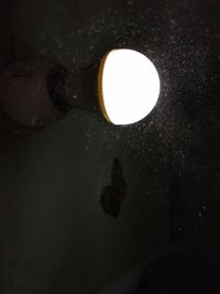 Close-up of illuminated light bulb