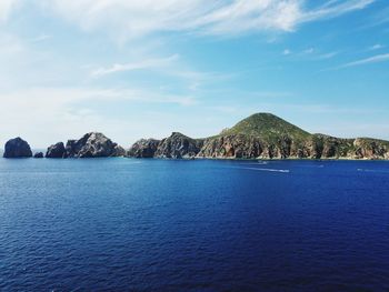 Scenic view of sea against blue sky