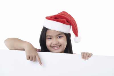 Portrait of a smiling girl over white background