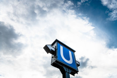 Low angle view of security camera against sky