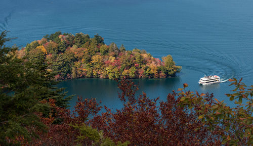 Scenic view of lake and trees against sky