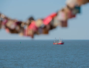 Nautical vessel on sea against sky