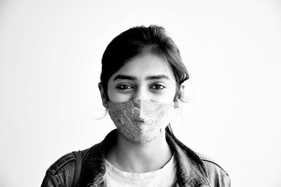 Portrait of a beautiful young woman over white background