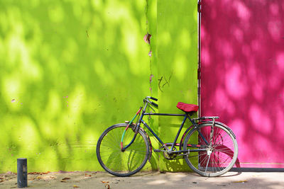 Bicycle parked against wall