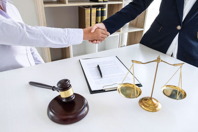 Midsection of man standing on table