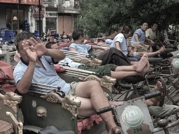 People sitting in front of building