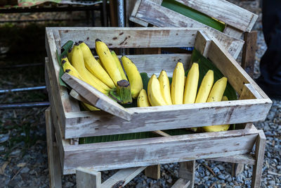 High angle view of bananas in crate for sale