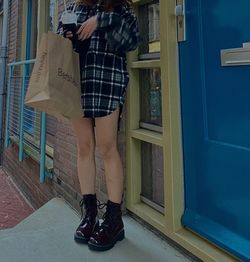 Low section of woman standing by door