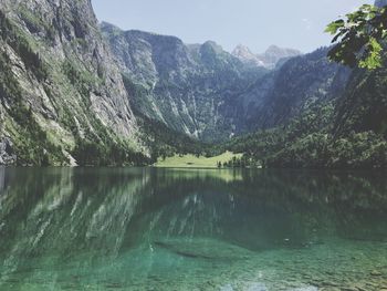 Scenic view of lake and mountains against sky