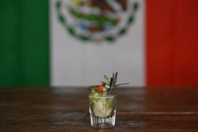 Glass of drink on table