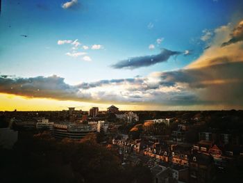 High angle shot of townscape against sky at sunset