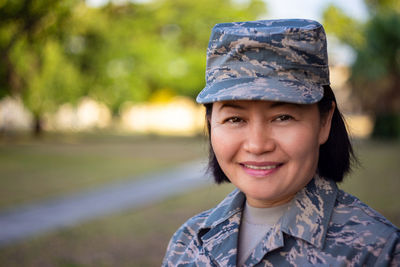 Portrait of smiling woman in military uniform