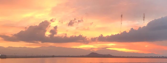 Scenic view of lake against sky during sunset