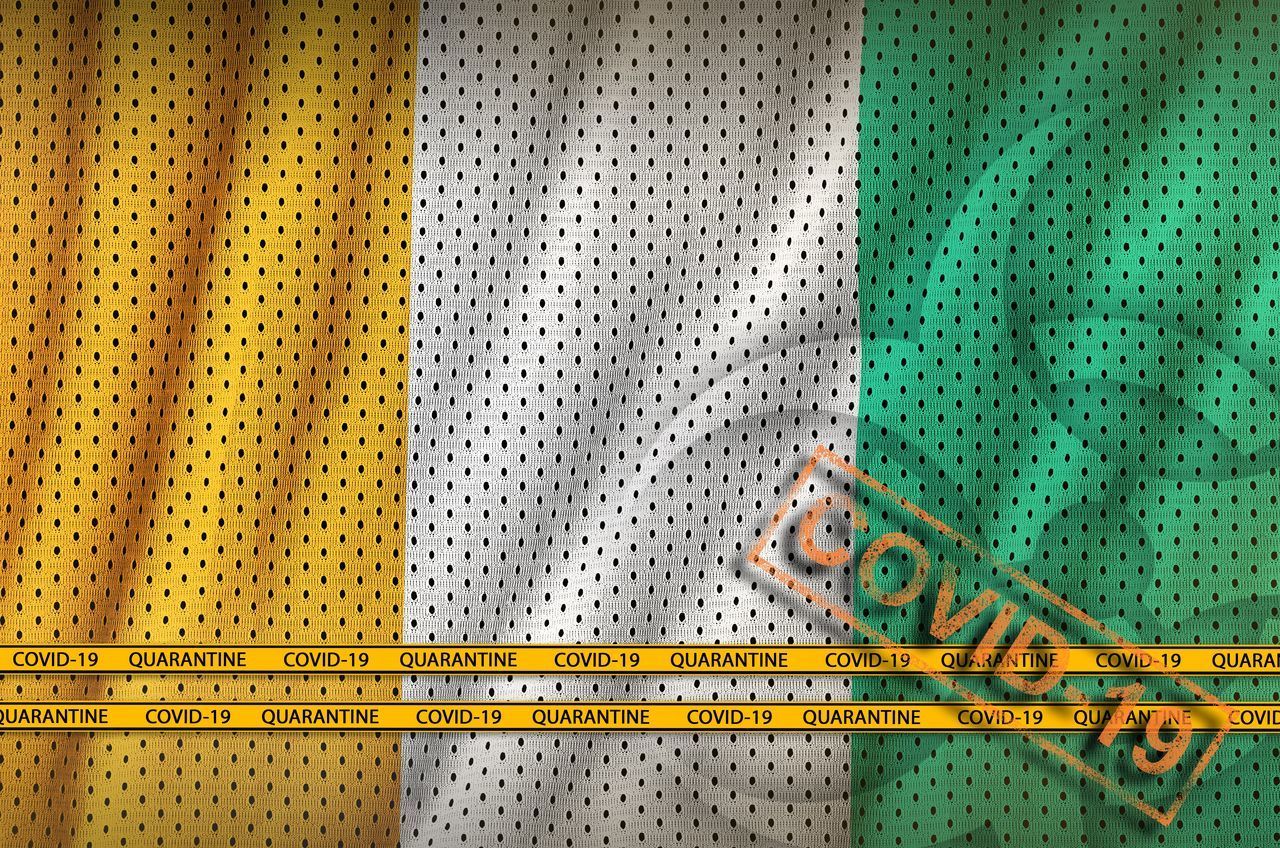 FULL FRAME SHOT OF YELLOW LINES ON GREEN BACKGROUND