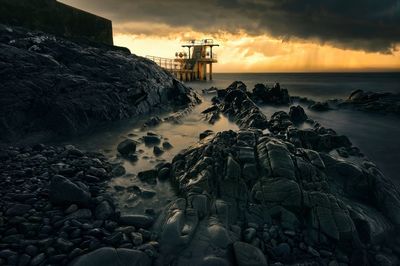 Dramatic sunrise at blakrock tower on salthill beach,galway,ireland