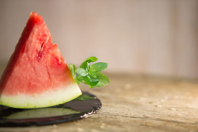 Close-up of watermelon in plate on table