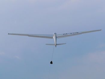 Low angle view of airplane flying in sky