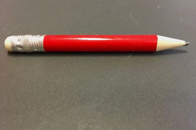 Close-up of red container on table