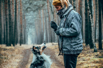 Man with dog in forest