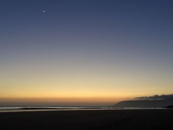 Scenic view of sea against sky at sunset