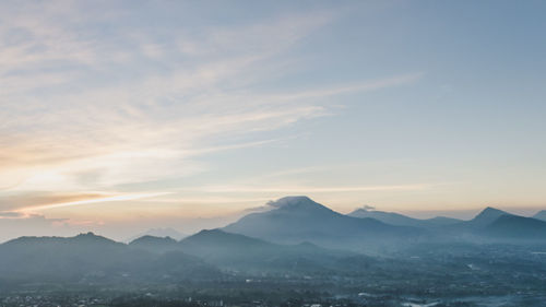 Scenic view of mountains against sky during sunset
