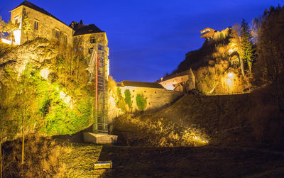 Low angle view of old building against blue sky