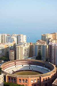 High angle view of buildings in city against clear sky