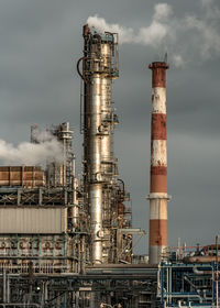 Low angle view of smoke stack against sky