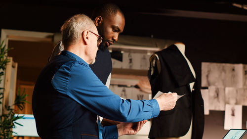 Side view of business colleagues shaking hands