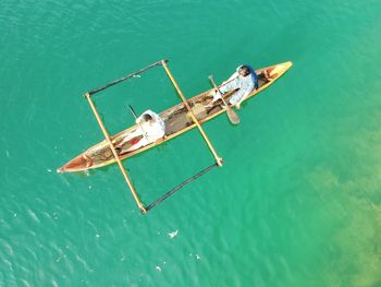 High angle view of people on boat in sea