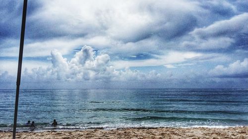 Scenic view of sea against cloudy sky