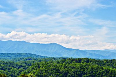 Scenic view of mountains against cloudy sky