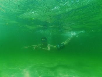 People swimming in sea