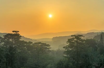 Scenic view of mountains against sky during sunset