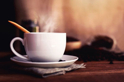 Close-up of coffee cup on table