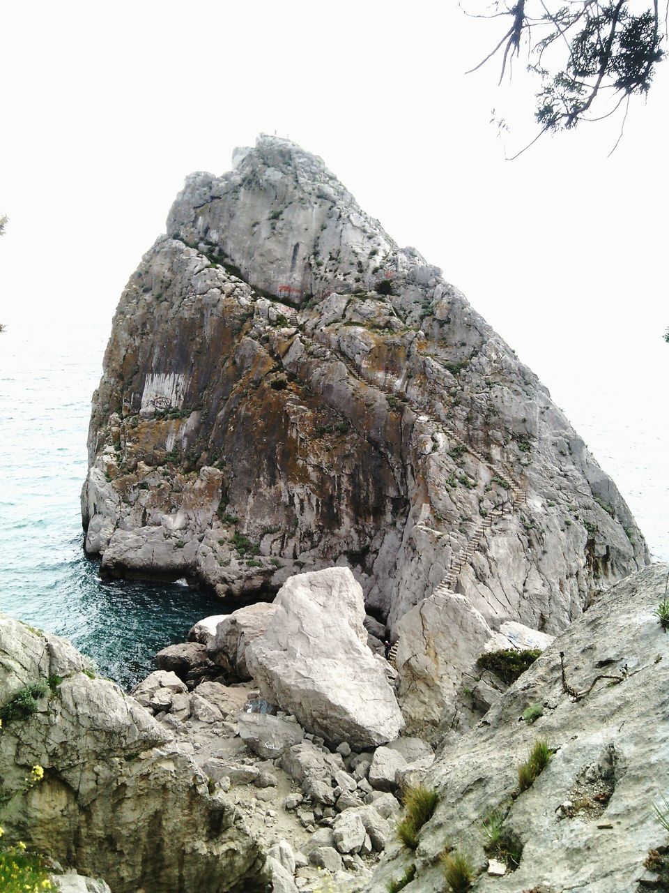 rock formation, rock - object, tranquility, tranquil scene, mountain, nature, scenics, clear sky, beauty in nature, rock, rough, geology, rocky mountains, cliff, rocky, textured, sky, low angle view, non-urban scene, day