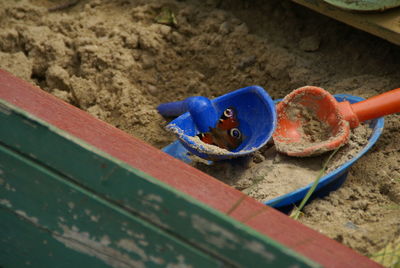 Close-up of blue toy on sand