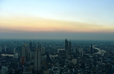 High angle view of buildings against sky during sunset