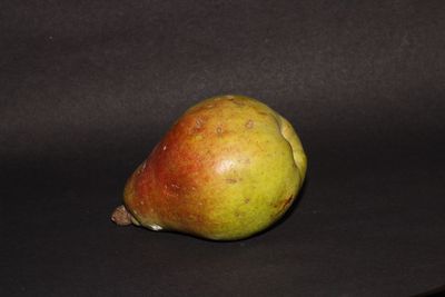 Close-up of apple against black background