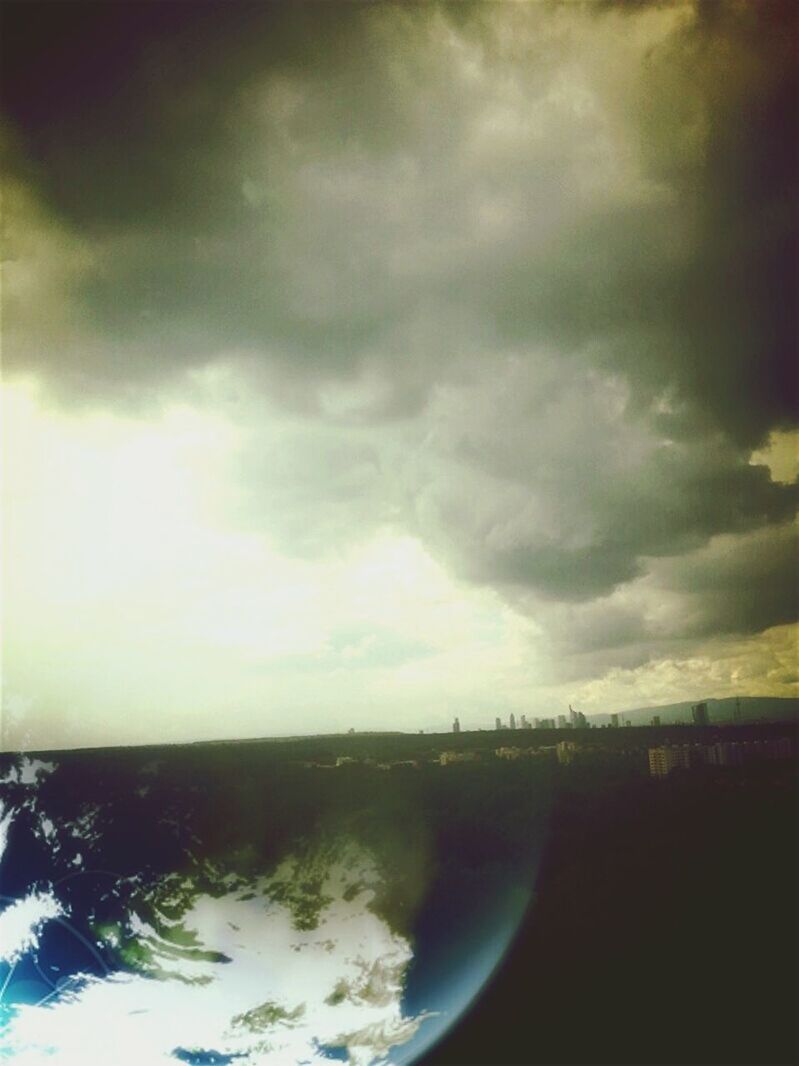 VIEW OF SEA AGAINST CLOUDY SKY