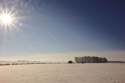 Scenic view of sea against sky during winter