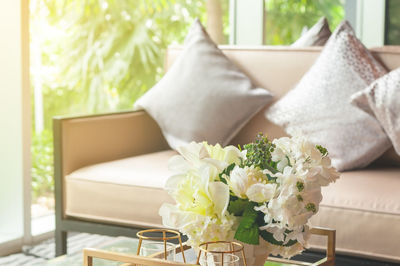 White flower vase on table at home