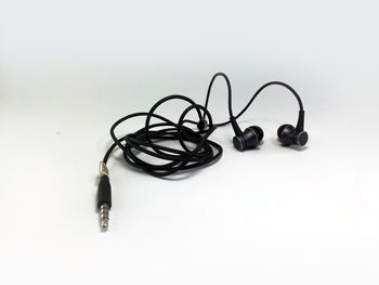 High angle view of eyeglasses on table against white background