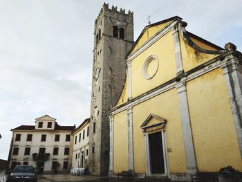 Low angle view of clock tower against sky