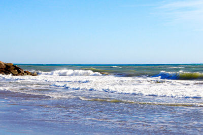 Scenic view of sea against clear sky