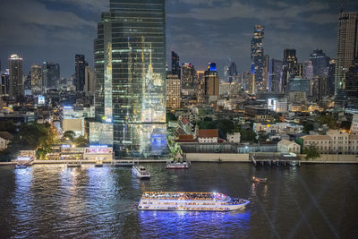 Illuminated buildings in city at night