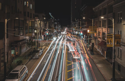 High angle view of light trails on city street at night