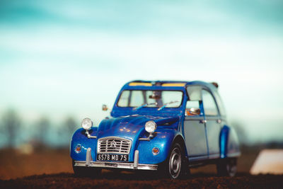 Close-up of toy car on road