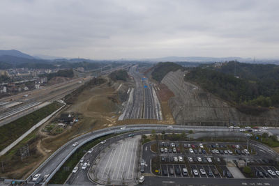 High angle view of highway in city against sky