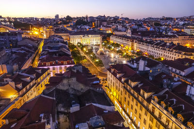 High angle view of illuminated city buildings